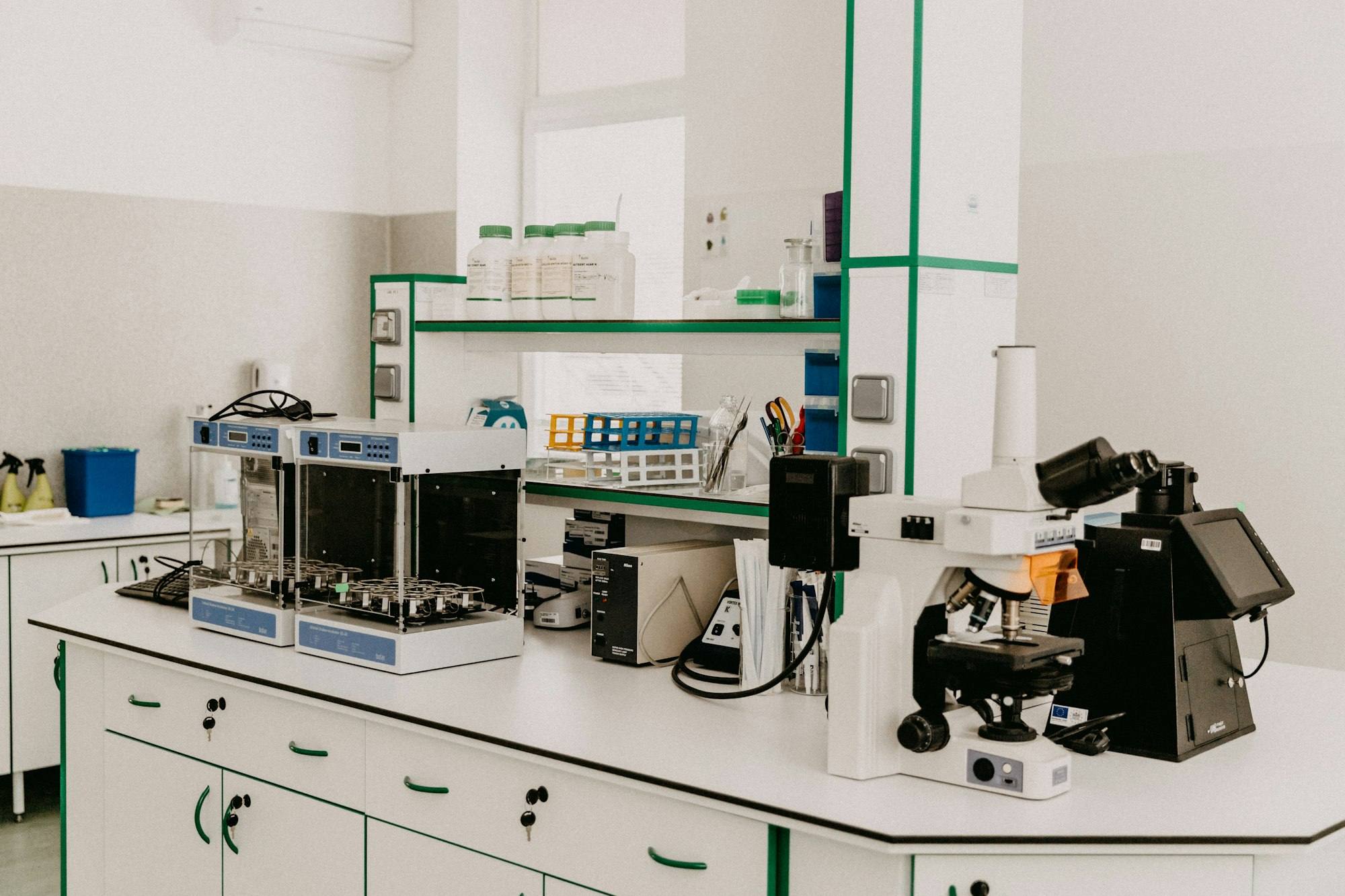 A laboratory bench with analytical equipment in a bright room